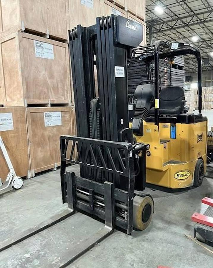 Front angled view of refurbished 2016 Bendi B40AC SwingMast forklift showing 42" forks, solid cushion tires, 48 volt chassis, quad mast, and CSA certification decal during Brampton deployment.
