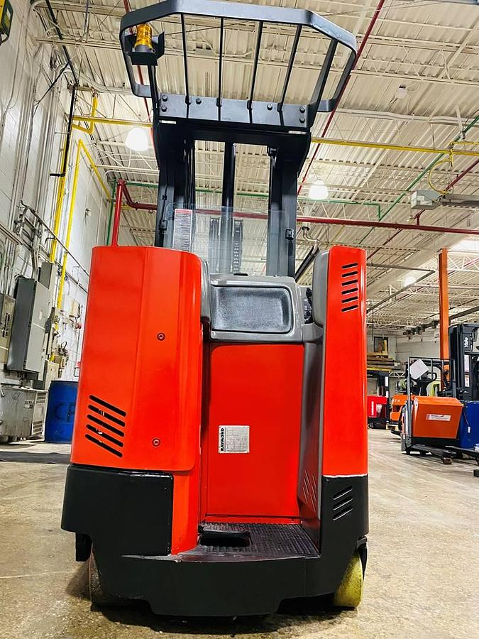 Back view of vintage 1996 Raymond EASIR40TT electric reach truck showing rear chassis, battery door, counterweight, and CSA inspection decal during Concord deployment