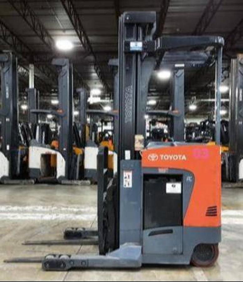 Opposite side view of Toyota 8BRU23 electric reach truck – CSA-certified 4,500 lb reach unit with compact chassis, tapered forks, and 36V battery compartment – Premier Lift Equipment Brampton ON