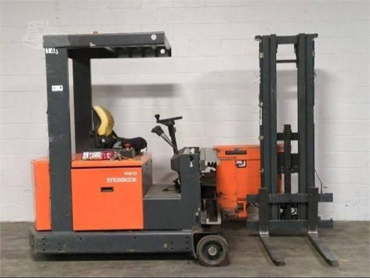 Side view of refurbished 1999 Steinbock VM13 swing mast man‑down turret truck showing 2" forks, 48 volt chassis, 203" lift mast, and CSA certification decal during Brampton deployment.