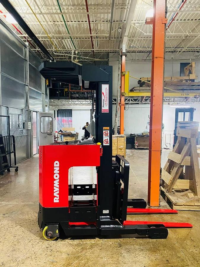 Refurbished 2003 Raymond ET-30RTT electric reach truck with CSA certification and new paint deployed in Mississauga for narrow aisle warehouse operations