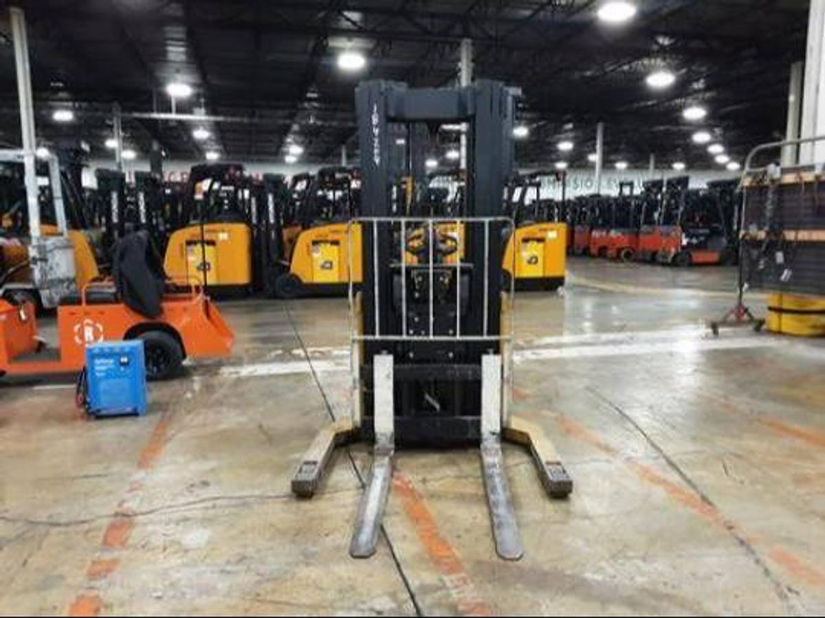 Front view of refurbished 2011 Yale MR03030 electric walkie reach stacker showing fork carriage, mast extension, and single reach mechanism during Ontario deployment