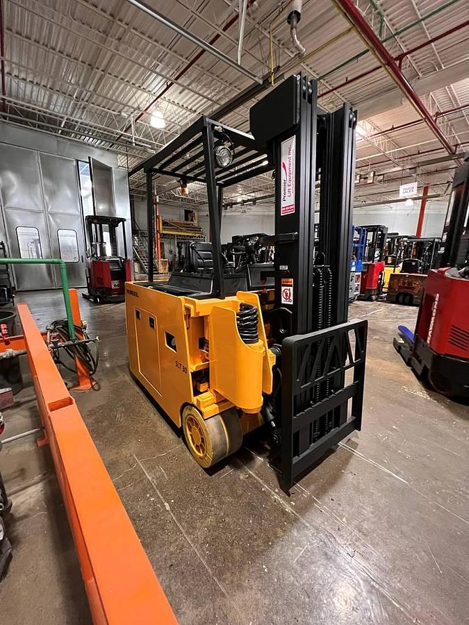 Front angled view of Drexel SLT30 electric swing mast forklift showing mast rails, fork tips, and CSA-certified chassis – unit staged in Brampton ON