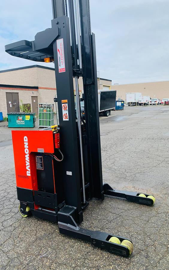 Side profile of Raymond ET‑R40TT Budget reach truck with forks raised — 226” mast.