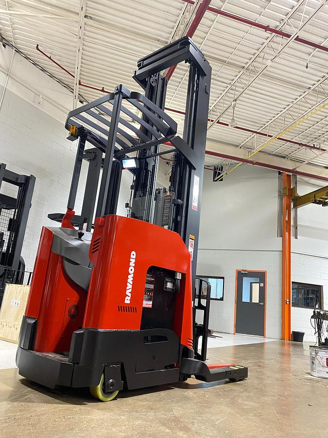 Rear right angle view of 2022 Raymond 752-DR32TT deep reach forklift showing cold storage conditioning package, rear vertical guard posts, poly tires, and CSA-certified chassis – unit staged in GTA ON