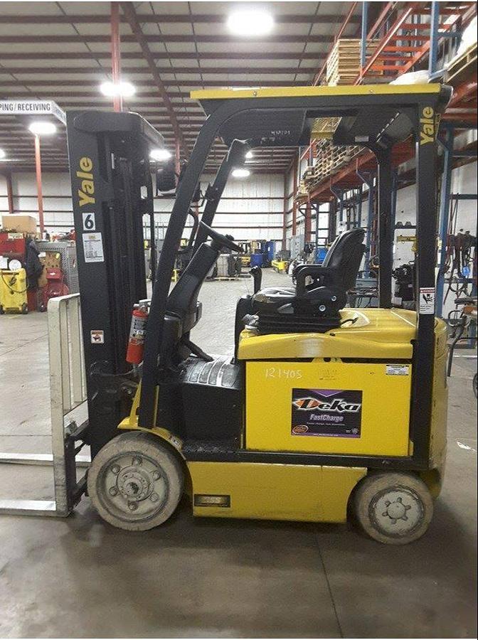 Side view of refurbished 2014 Yale ERC050VGN electric forklift showing operator cab, chassis, and quad mast during Brampton deployment