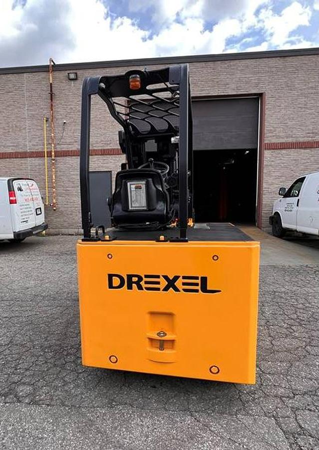 Rear side angle of Drexel SL-40AC SwingMast forklift showing counterweight, rear wheels, and CSA certification during warehouse deployment