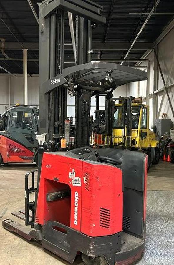 Rear‑side angle of a 2021 Raymond 750‑DR32TT deep‑reach forklift showing drive unit, operator compartment, and CSA‑certified refurbishment.