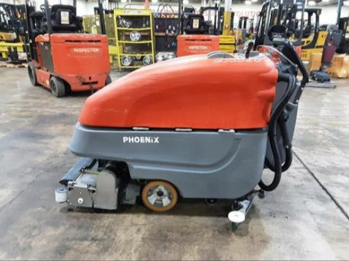 Side profile view of 2023 PowerBoss Phoenix 26 industrial scrubber with Aqua-Stop system and solution tank