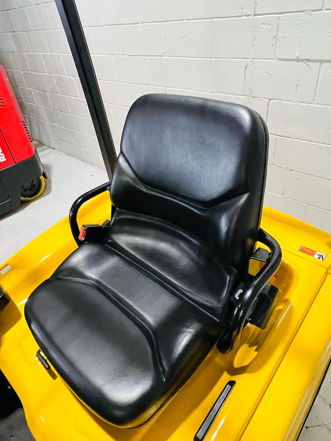 Operator seat view of 2018 Yale ERP030VTN 3-wheel electric forklift – CSA-certified 3,000 lb chassis with suspension seat, ergonomic fingertip controls, and OPSS safety system shown refurbished and sold chassis-only – safety-tagged in Brampton ON – Premier Lift Equipment