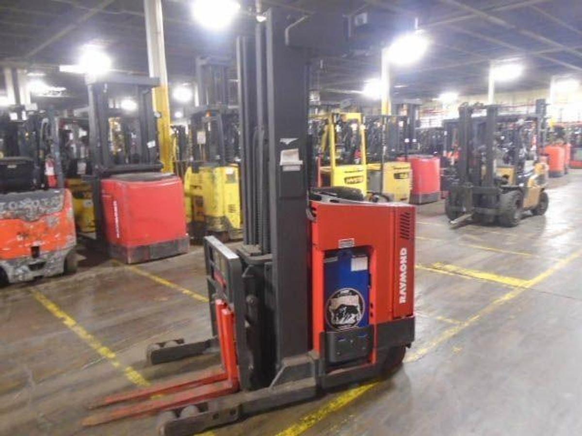 Opposite side view of refurbished 1998 Raymond EASIR40TT electric reach truck showing reach mechanism, chassis structure, and mast rails during Mississauga deployment