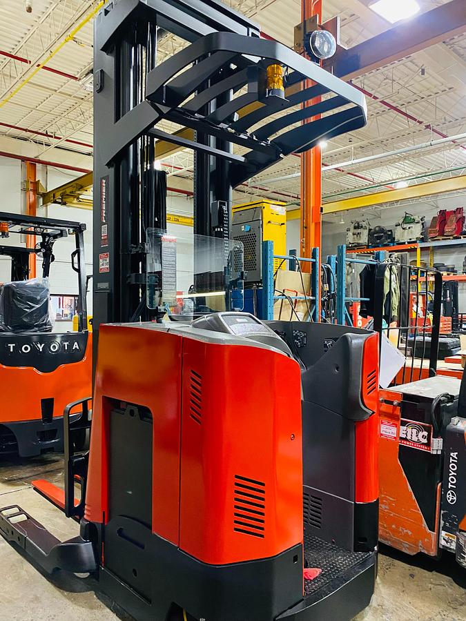 Rear side angle of Raymond 750DR32TT deep-reach forklift showing counterweight, rear wheels, and CSA certification during warehouse deployment