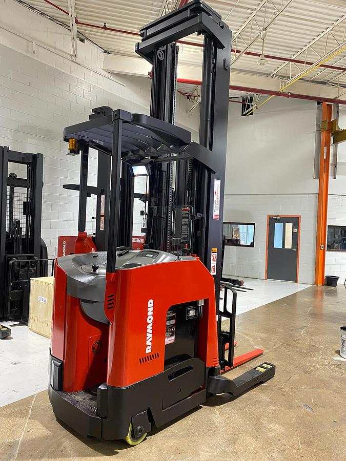Rear right angle view of 2022 Raymond 752-DR32TT deep reach forklift showing cold storage conditioning package, rear vertical guard posts, poly tires, and CSA-certified chassis – unit staged in Brampton ON