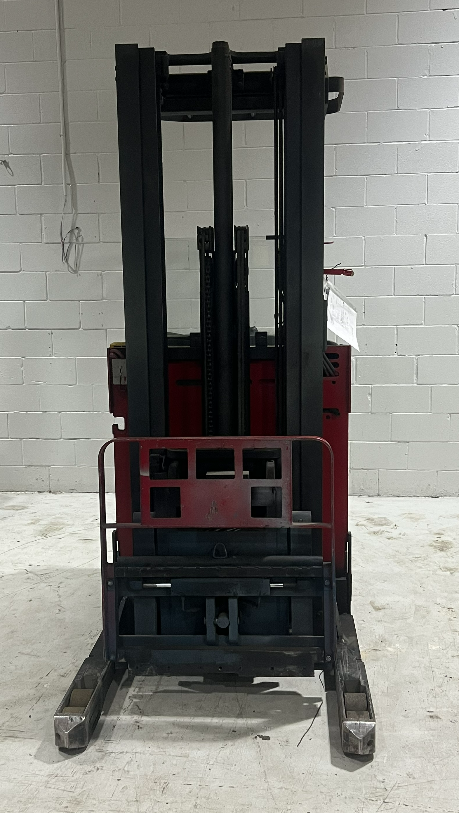 Front View: Raymond EASI‑R45TT reach truck showing forks and mast.
