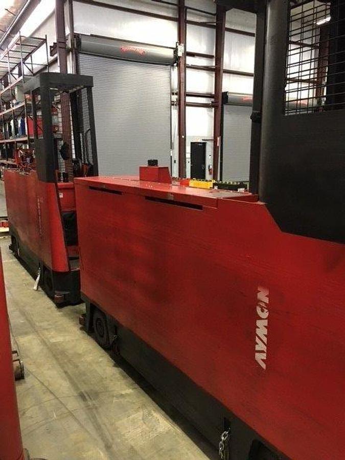 Rear view of Raymond 9300-SL60TN sideloader showing counterweight, operator cab, and CSA certification during warehouse deployment