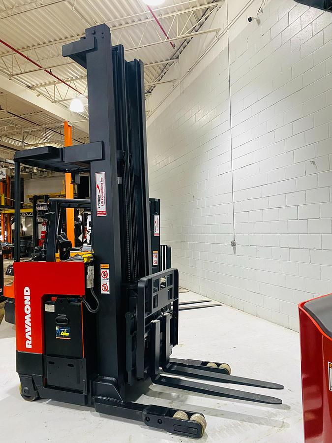 Opposite side view of Budget Raymond reach truck — mast rails, chassis, and reach carriage.