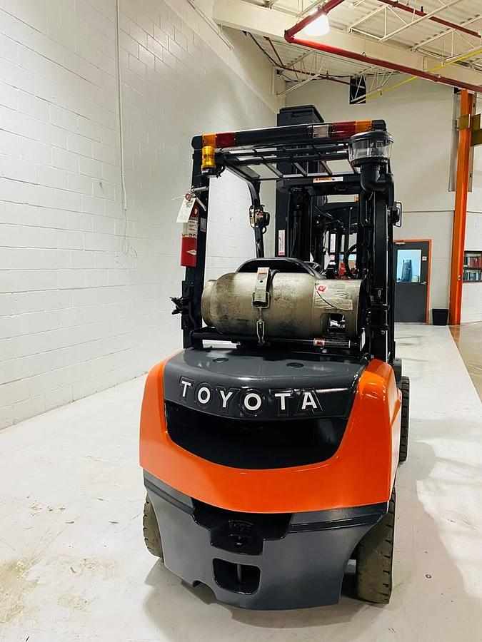 Rear view of 2022 Toyota 50-8FGU25 forklift showing counterweight, LP tank bracket, and solid pneumatic tires – CSA certified unit in Brampton ON