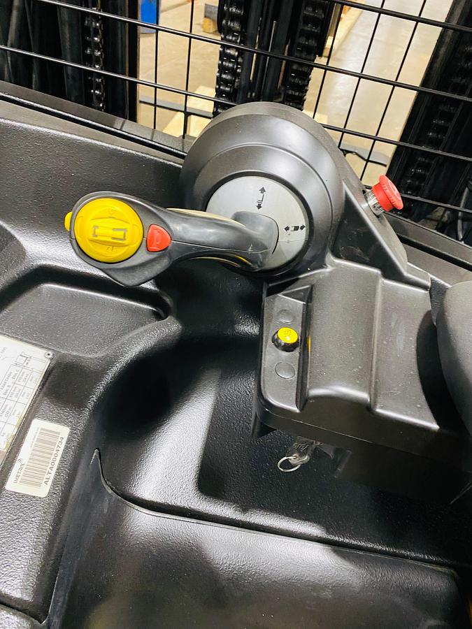 Operator compartment view showing stand-up controls and ergonomic handle