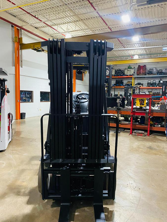 Front mast view of Toyota 8FBCU25 electric forklift – CSA-certified 5,000 lb cushion tire unit with triple-stage mast to 189” and side-shift carriage – Premier Lift Equipment Brampton ON