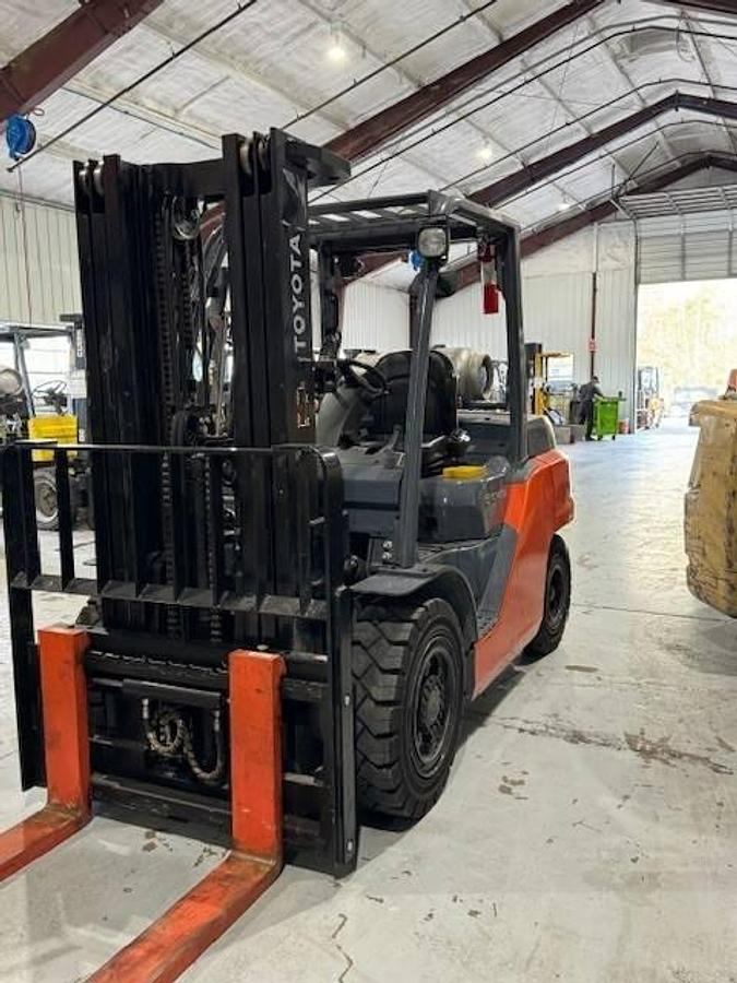 Front view of refurbished Toyota LP gas forklift showing mast, carriage, and solid tire chassis during Brampton deployment