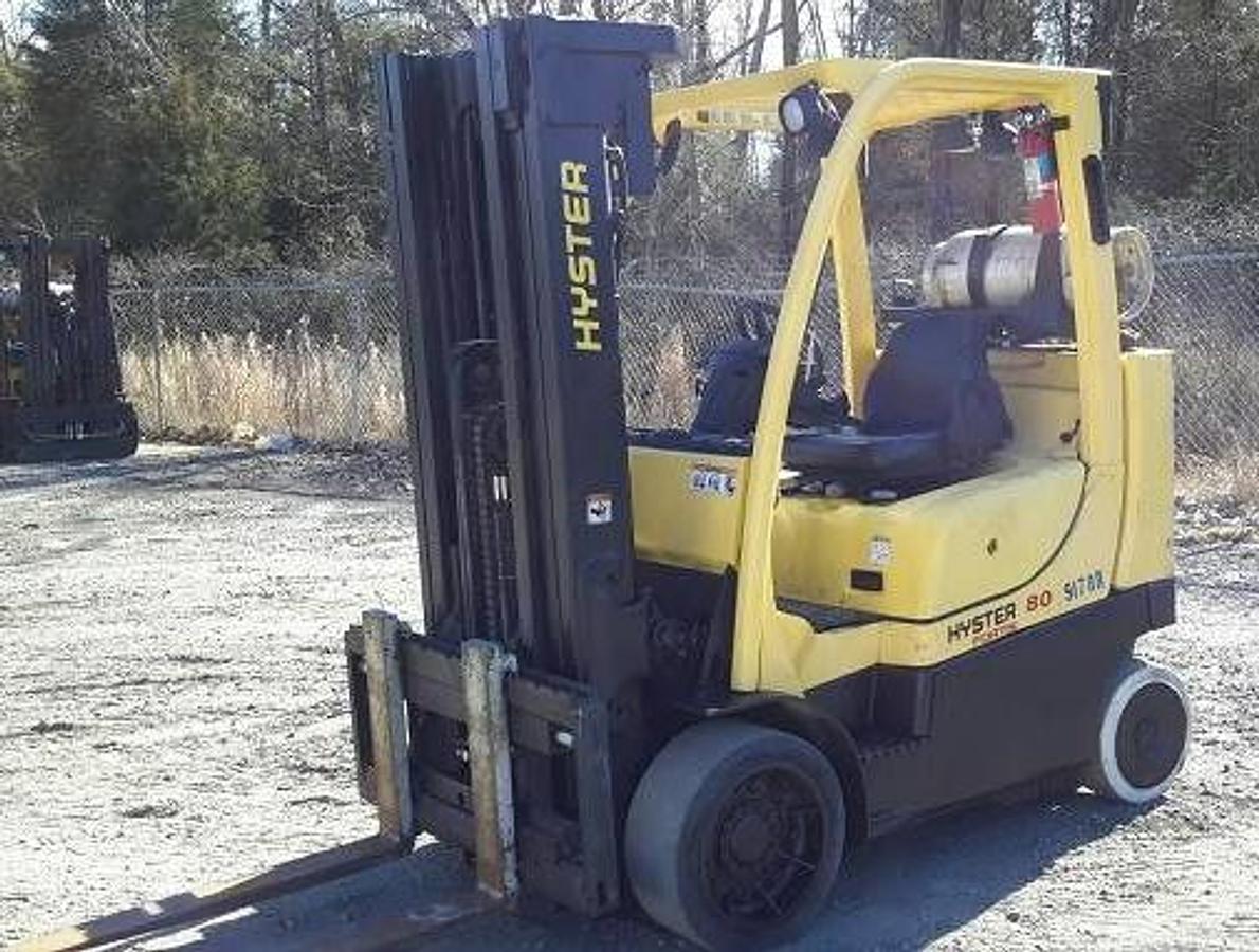 Front side view of refurbished 2015 Hyster S80FT BCS LP Gas forklift showing 42" forks, 185" lift height, side shift, solid tires, short footprint Boxcar Special design, and CSA certification decal during Ontario deployment.