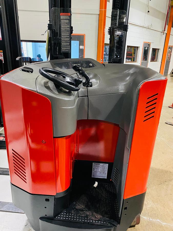 Operator compartment view showing stand-up controls and side-stance layout