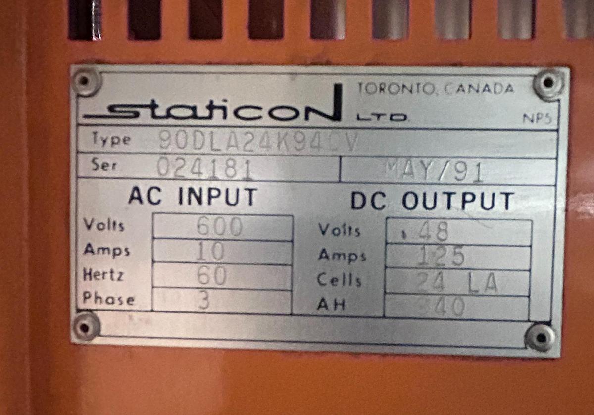 “Staticon charger dataplate showing model 90DLA24K94, serial 024181, 24V 48.5A output, 12‑cell lead‑acid specs, and 600V 3‑phase input.”