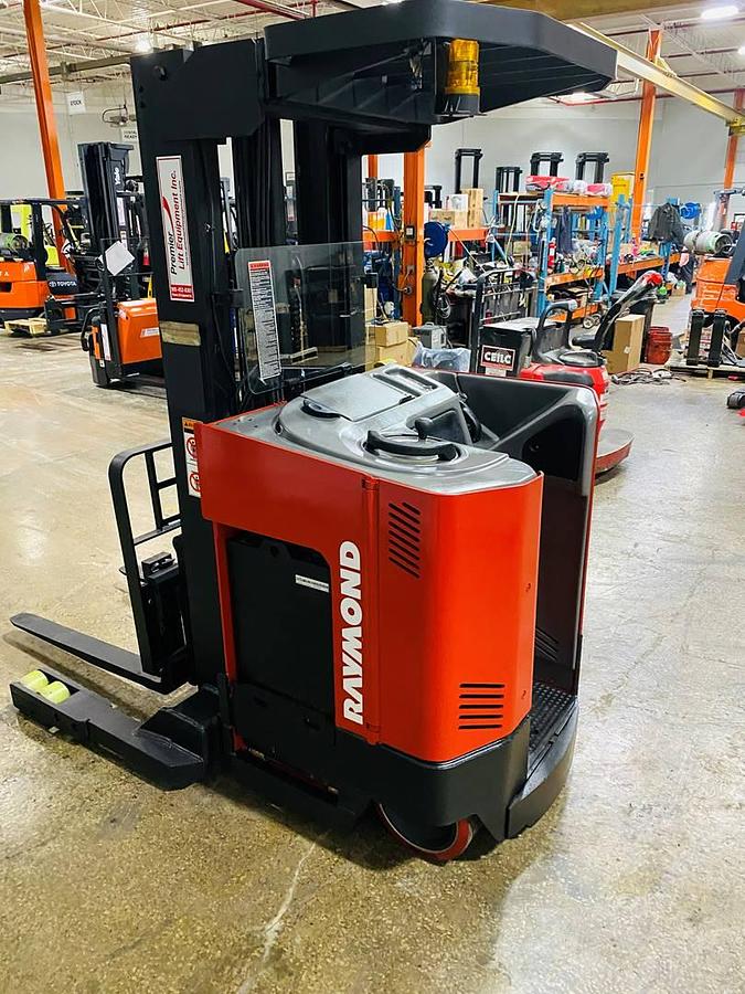 Opposite side view of vintage 1996 Raymond EASIR40TT electric reach truck showing reach mechanism, drive unit cover, and chassis structure during Concord deployment