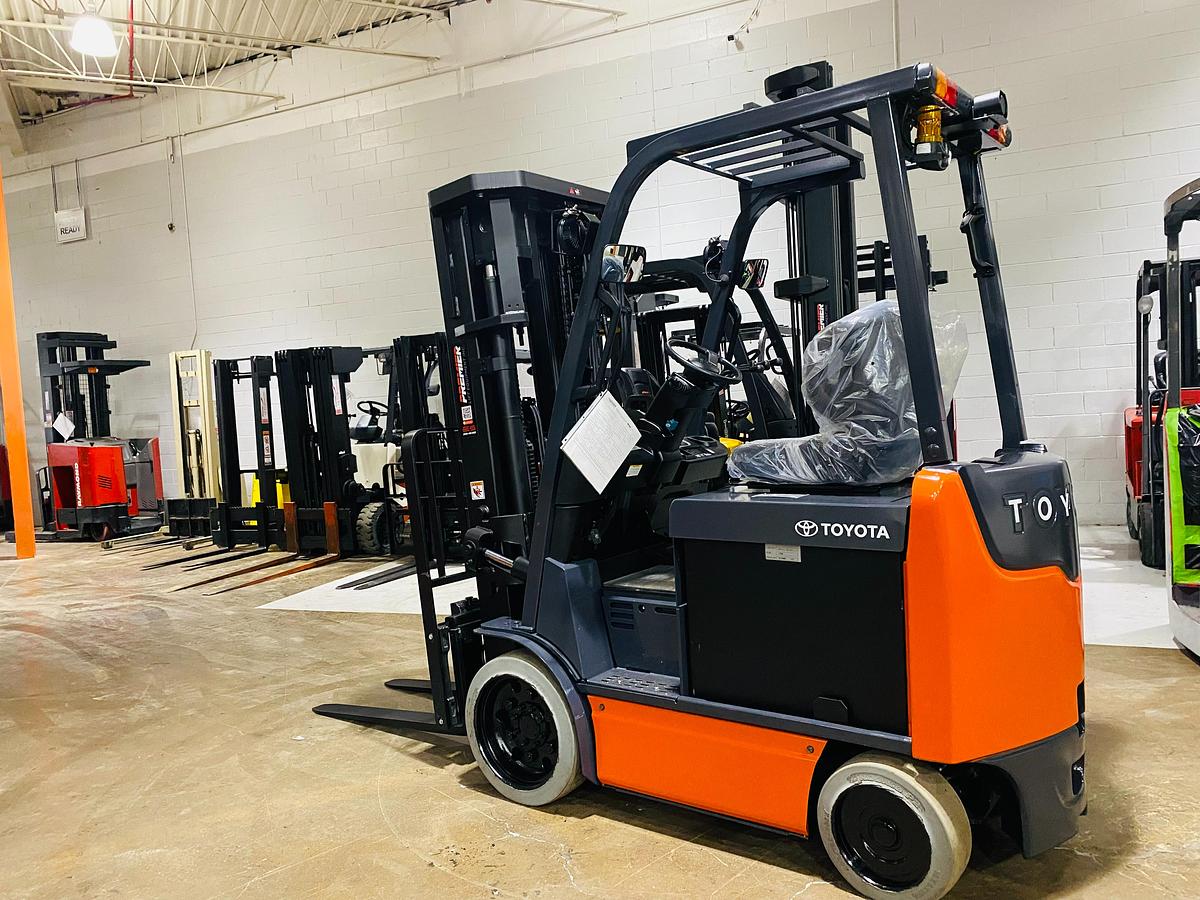 Opposite rear angle of Toyota 8FBCU25 forklift – CSA-certified 5,000 lb electric sit-down with triple mast, rear safety lighting, and smooth tread tires – Premier Lift Equipment Brampton ON