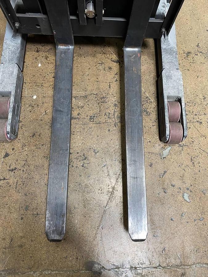 view of forks and straddle legs with poly load wheels