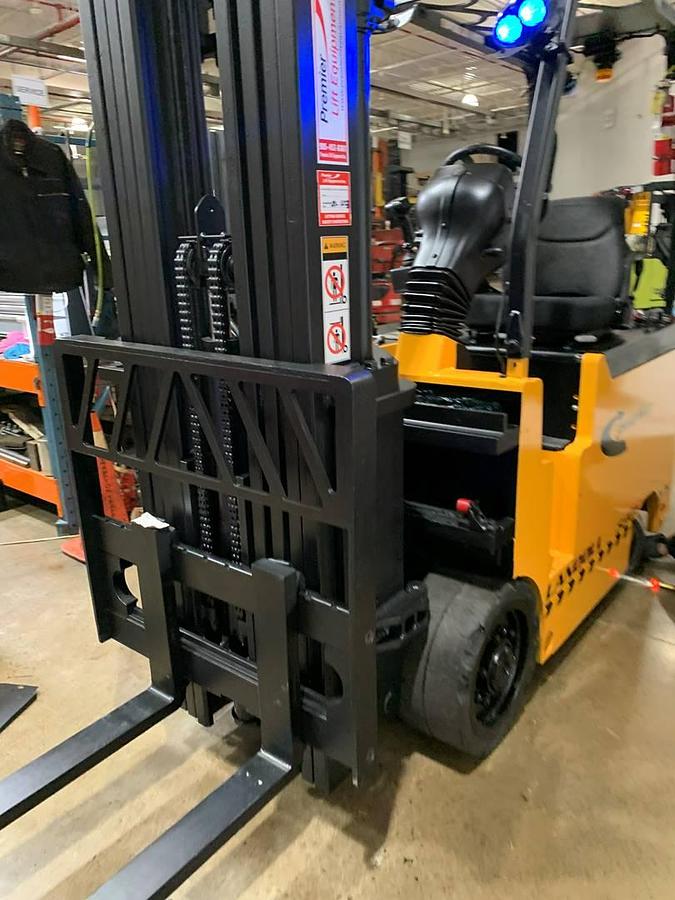Refurbished 2017 Drexel SL-40AC electric SwingMast forklift with 250" quad mast and CSA decals shown at front side angle during Brampton deployment
