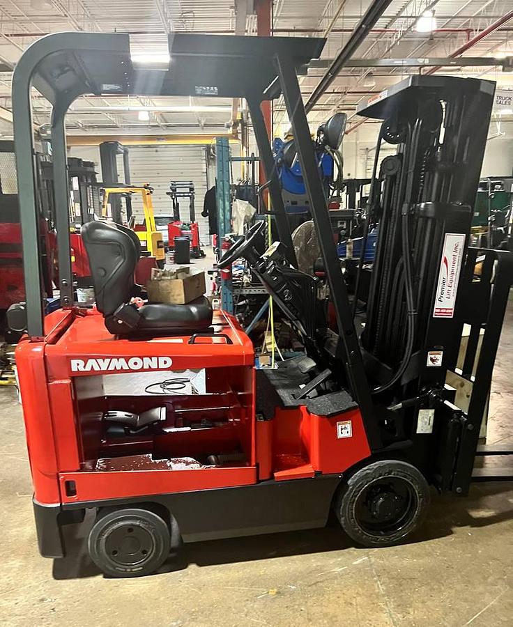 Side view of Budget Raymond DSD30R older 4‑wheel electric forklift indoors, non‑CSA..