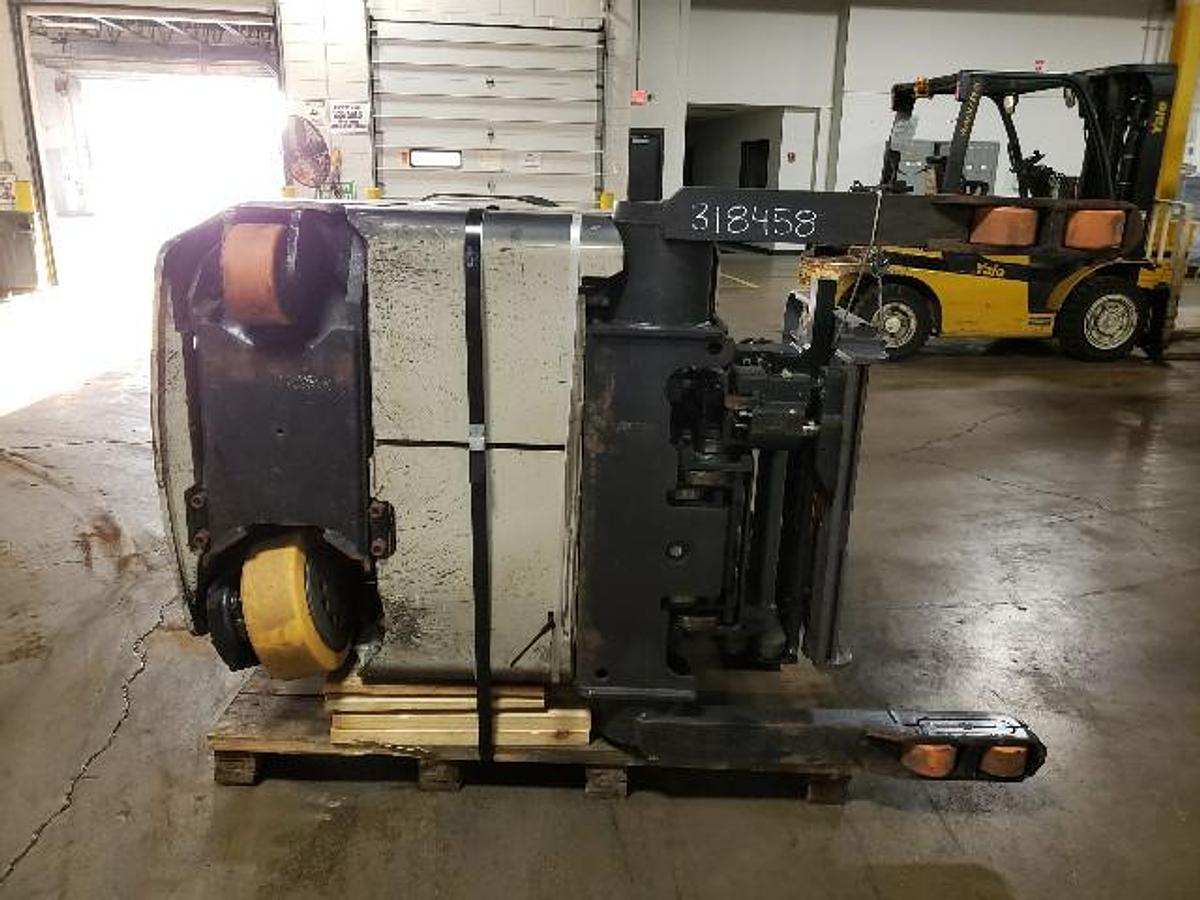 Underside chassis of 2021 Crown RMD6025-32 Reach Truck | Frame, steer axle, battery tray, and caster wheel visible | Crated for export | CSA Certified | Brampton ON