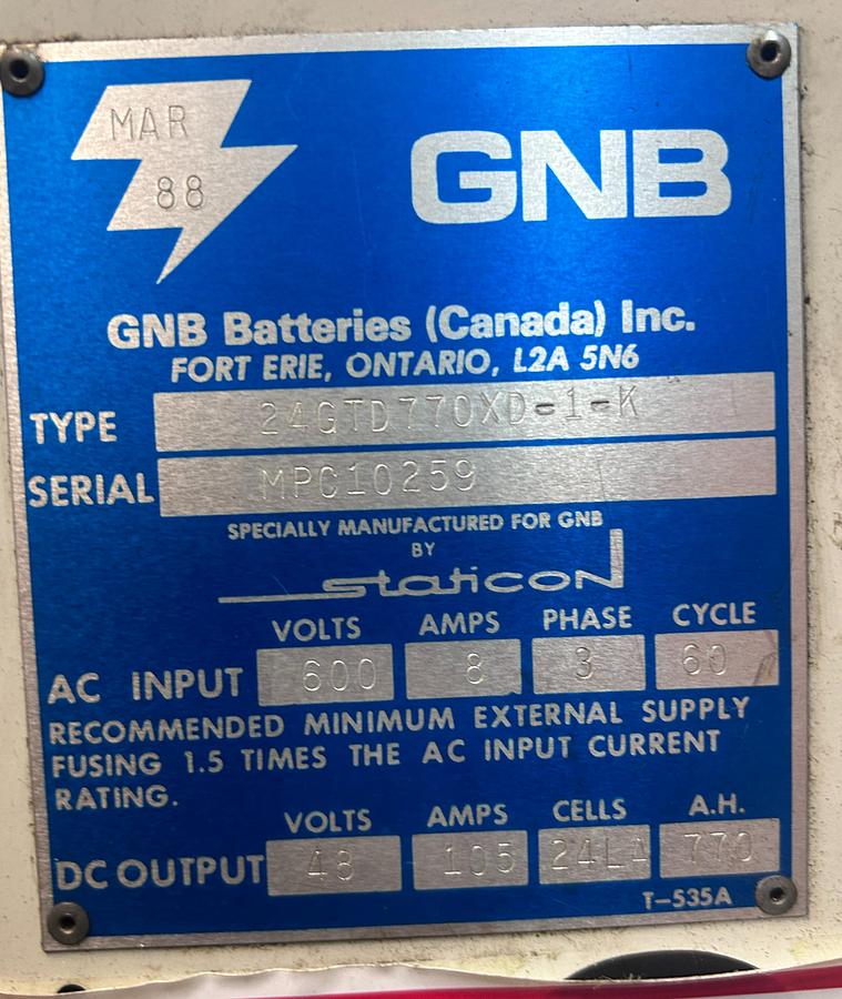“GNB charger dataplate showing model 24‑GTD‑770‑XD‑1‑FK, serial MPC‑10259, 48V 105A output, 24‑cell lead‑acid specs, and 600V 3‑phase input.”