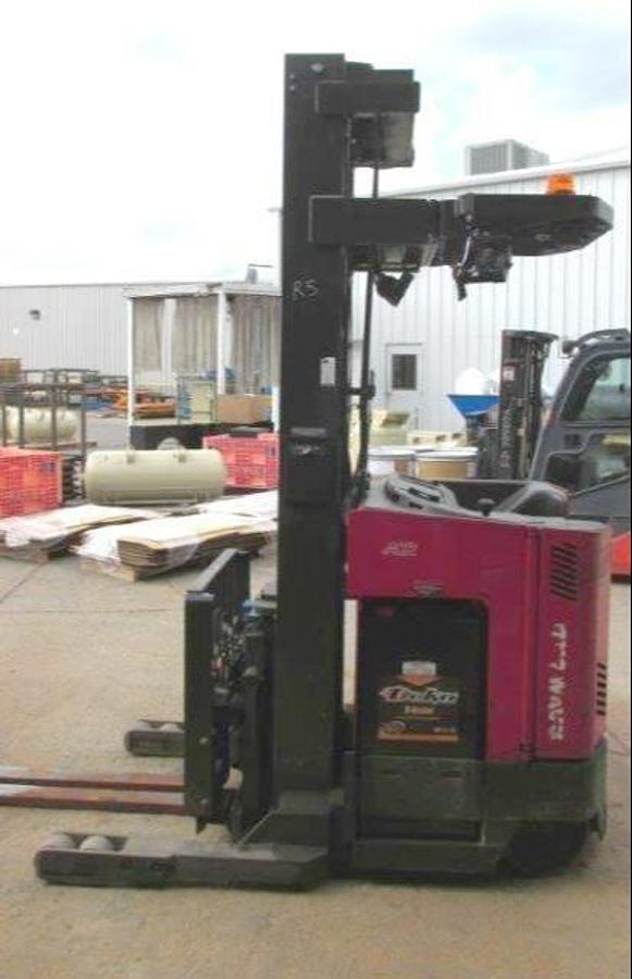 ide view of refurbished 2012 Raymond EASIR45TT electric reach truck showing battery compartment, chassis frame, and 48" forks during Mississauga deployment