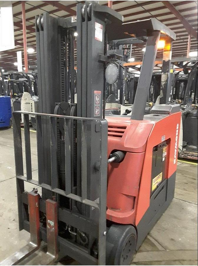 Front view of refurbished 2011 Raymond 425-C50TT electric docker showing triple mast rails, load backrest, 42" forks, and side shift carriage during Concord deployment