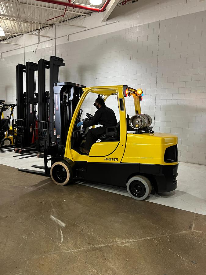 Hyster S120FT – side view with operator seated – propane forklift with fork positioner and CSA safety decals – Brampton ON