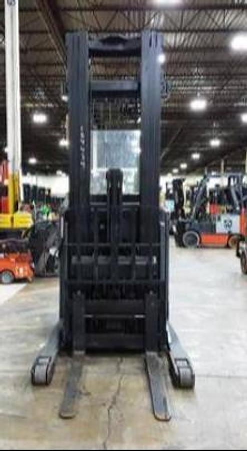 Front view of Toyota 8BRU23 electric reach truck – CSA-certified 4,500 lb narrow aisle forklift with 211” triple mast, tapered forks, and open-view mast design – Premier Lift Equipment Brampton ON