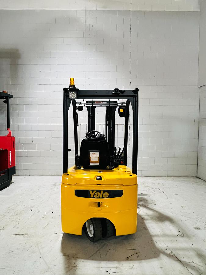 Rear view of 2018 Yale ERP030VTN electric forklift – CSA-certified 3,000 lb chassis with rear counterweight, overhead guard, and safety lighting shown refurbished and sold chassis-only – safety-tagged in Brampton ON – Premier Lift Equipment