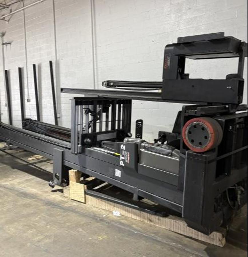 Raymond 9700-CSR30T – turret truck laid down in cradle – side view of mast and chassis secured for export – CSA/MOL certified – Brampton ON