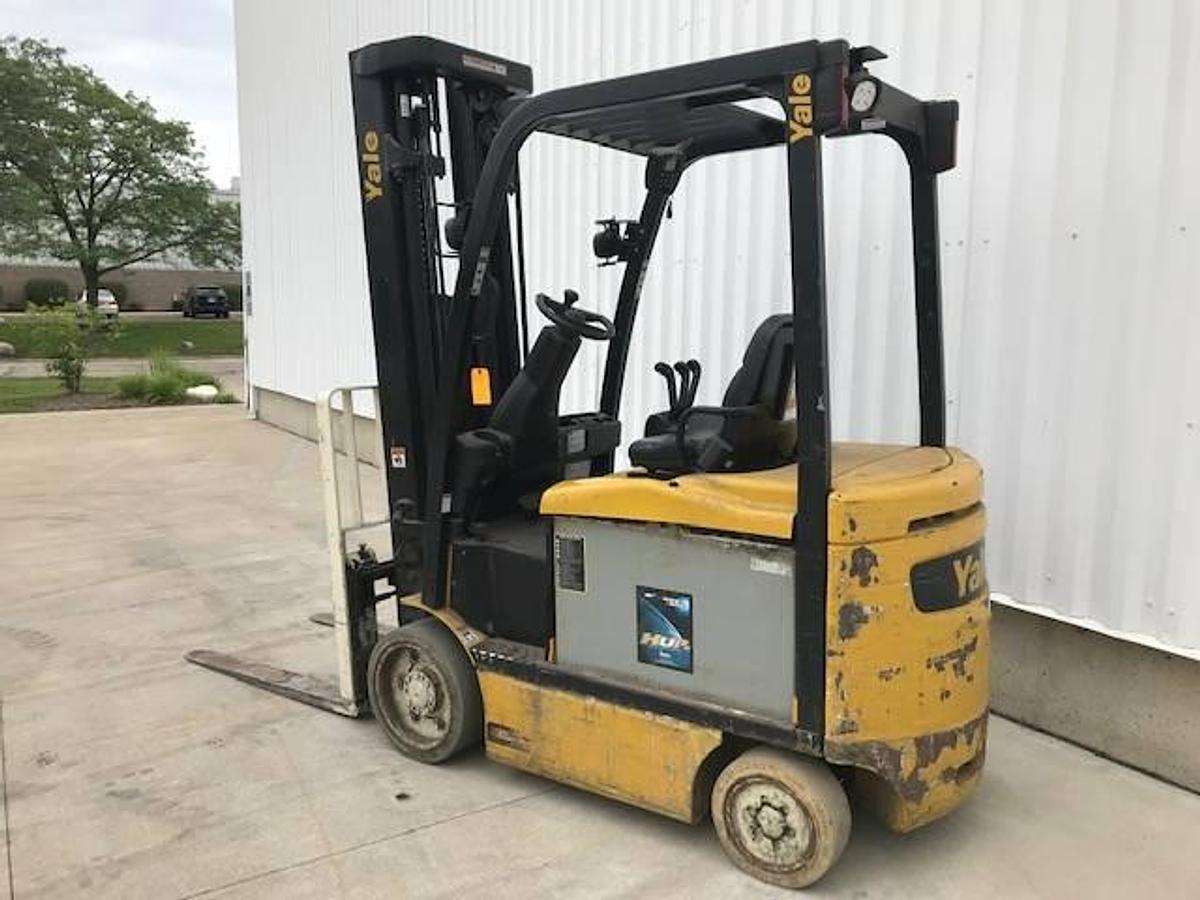 Back view of refurbished 2015 Yale ERC060VG electric forklift showing counterweight, battery compartment, and CSA inspection tag during Brampton deployment