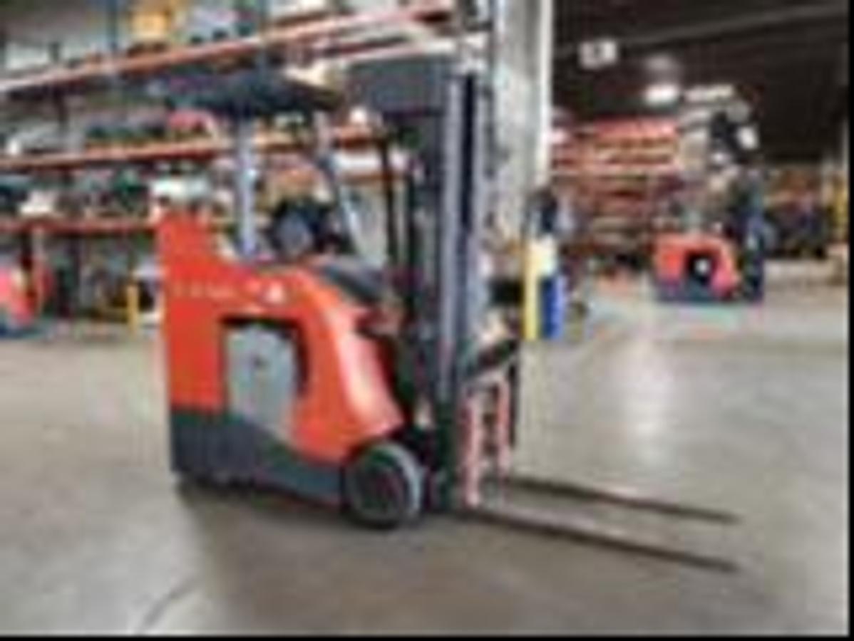Front angle side view of refurbished 2017 Toyota 8FBNCU20 electric counterbalance forklift showing fork tips, mast extension, and CSA certification decal during Ontario deployment