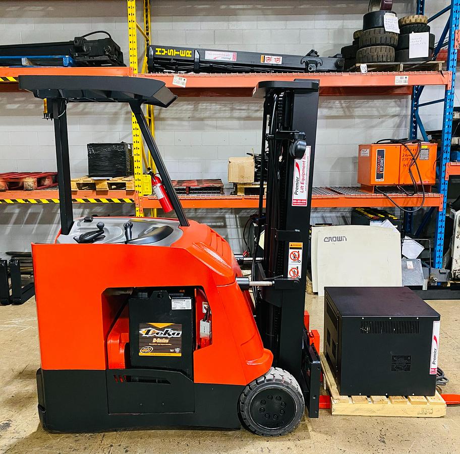 Generic stand-up dockstocker forklift with rear-stance operator compartment, electric end-control, no straddle legs, compact chassis, standard mast and forks.