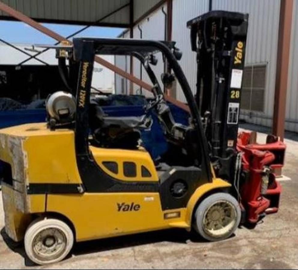 Side profile of 2016 Yale GLC120VX LPG cushion forklift showing mast rails, chassis layout, and cushion tires during Brampton deployment