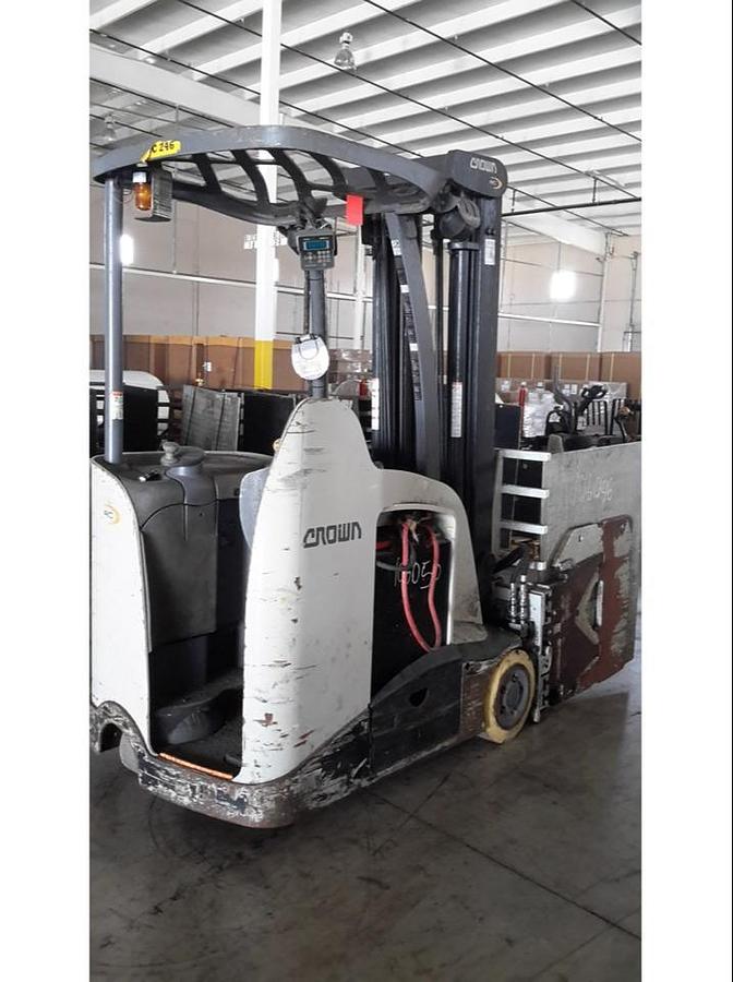 Rear side view of refurbished 2014 Crown RC5545‑40 electric forklift showing rear chassis, 36 volt battery compartment, and CSA certification decal during Ontario deployment.
