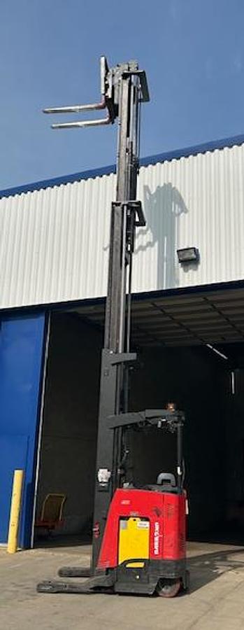 Side view of 2020 Raymond 750-R45TT electric reach truck with mast fully extended to 301” – CSA-certified 4,500 lb unit featuring triple mast, 42” forks with side shift, poly cushion tires, and 36V AC chassis staged in Brampton ON; shown chassis only without battery or charger, available separately as extra options new or used – Premier Lift Equipment