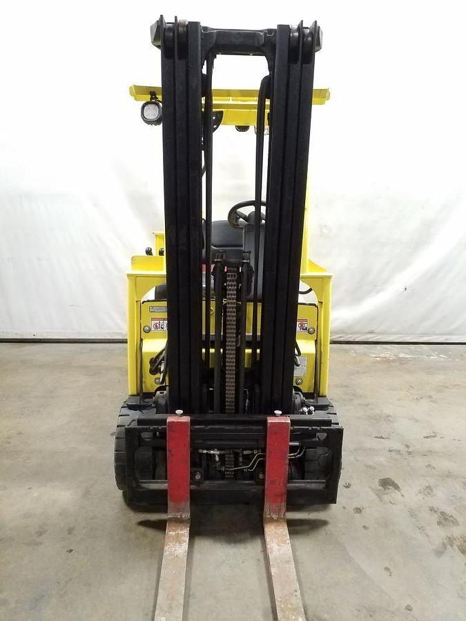 Front view of refurbished 2014 Hyster J40XNT 3‑wheel electric forklift showing 3‑stage mast, 42" forks, cushion tires, and CSA certification decal during Ontario deployment.