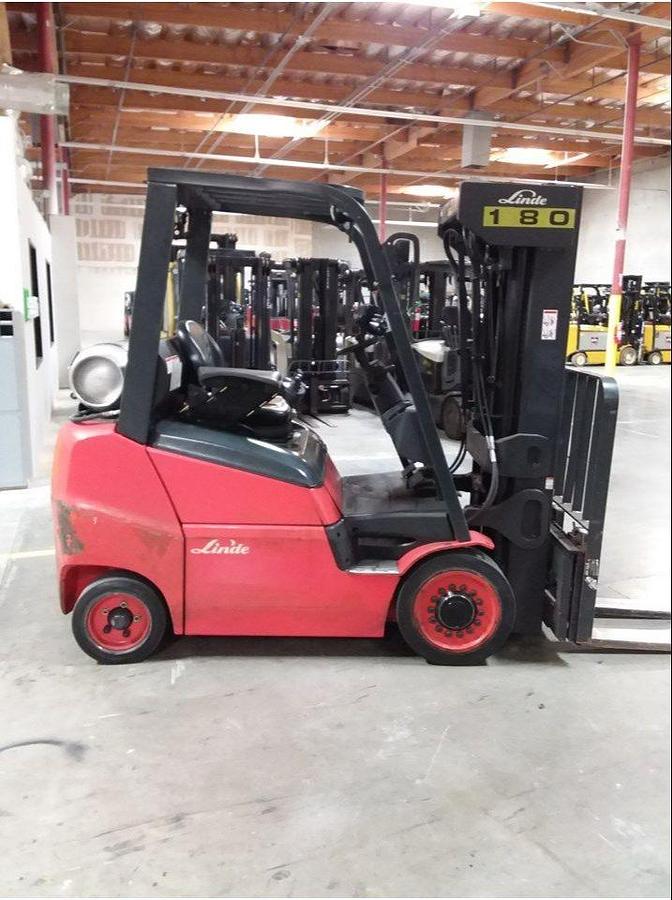 Opposite side view of refurbished 2016 Linde H25CT LPG forklift showing operator compartment, 60" forks, solid tires, load back rest, quad mast with side shift, and CSA certification decal during Brampton deployment.