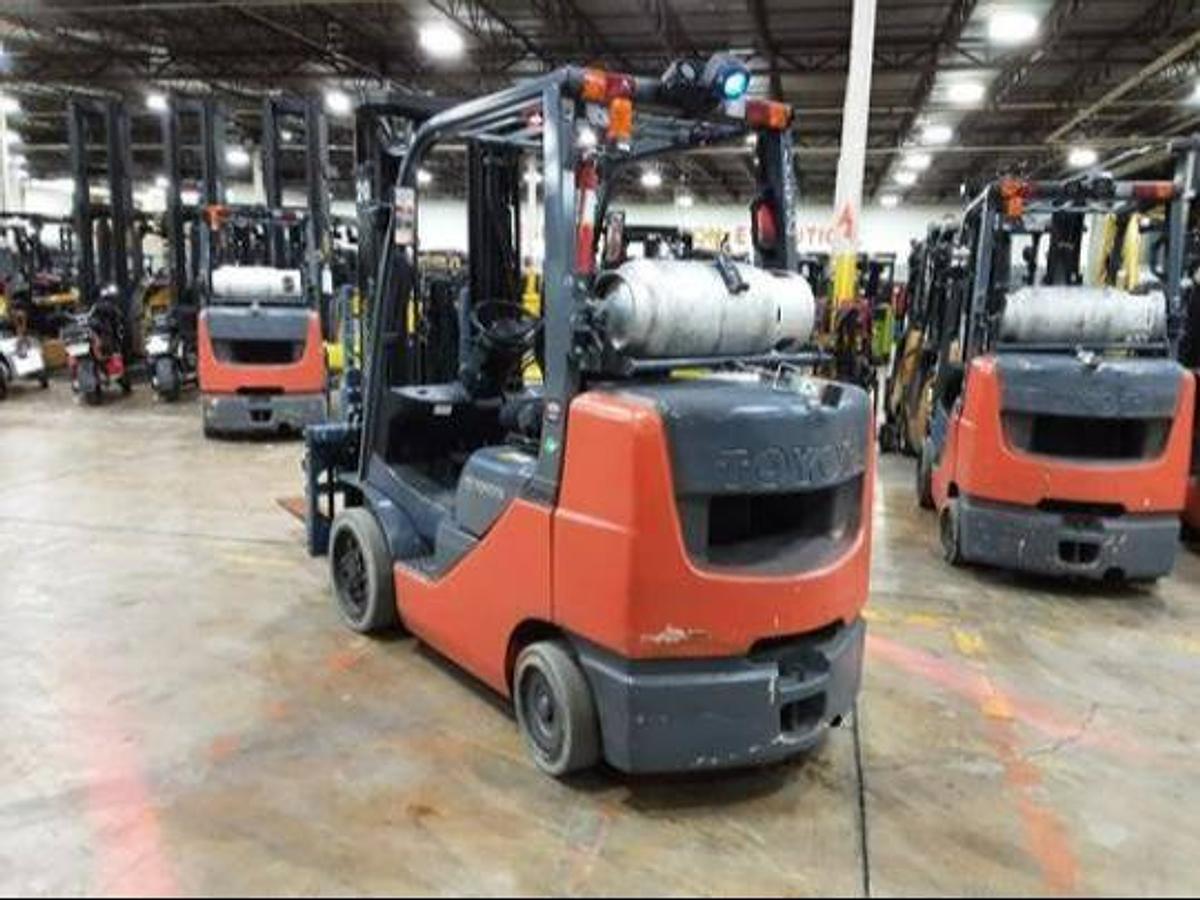 Opposite rear side angle of refurbished 2017 Toyota 8FGCU32 LP gas forklift showing rear chassis and propane tank mount during Brampton deployment