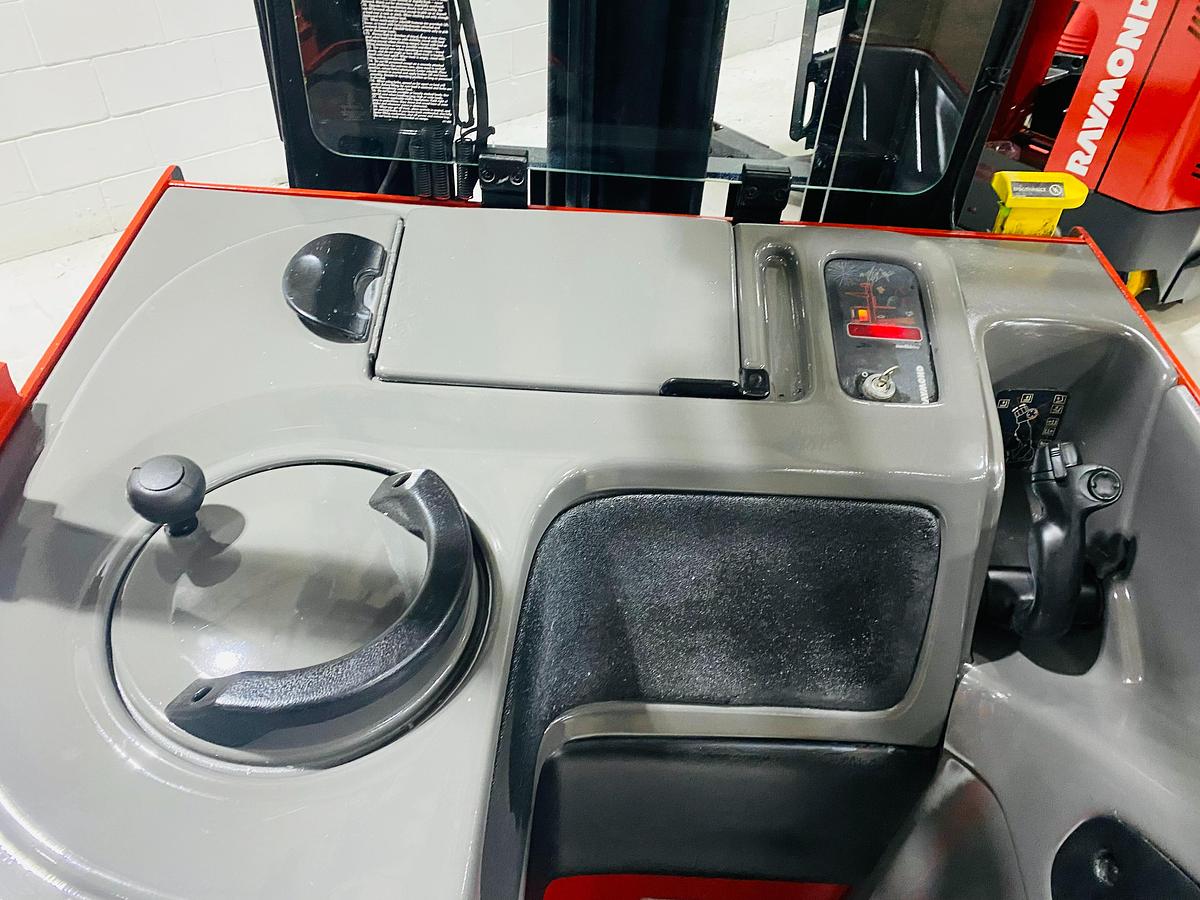 Operator controls on Budget Raymond reach truck — steer wheel, joystick, and control panel